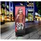 Direct view LED display being showcased in an outdoor shopping plaza displaying a graphic for a sale at a retail clothing store