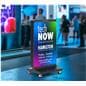 Foldable LED poster being shown in a trade show environment in its folding orientation