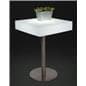 Square glow top bar table illuminated in white shown with a small planter