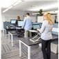 Height adjustable standing desk converter for office environments