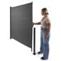 Retractable outdoor privacy divider extends quickly and easily 