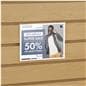 Acrylic gridwall sign holder being shown on a slatwall advertising a clothing sale