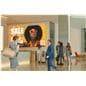 3x3 video wall being utilized in a public lobby space showcasing a retail clothing sale advertisement