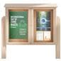 Free standing outdoor bulletin board exhibiting ecofriendly and environment awareness imagery posted in the cabinet doors