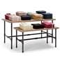 Nesting retail tables with folded garments