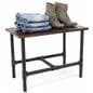 Small Pipe Display Table Showcasing Folded Jeans