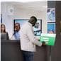 Mobile rechargeable kiosk showcasing someone using this unit as a healthcare sign in sheet